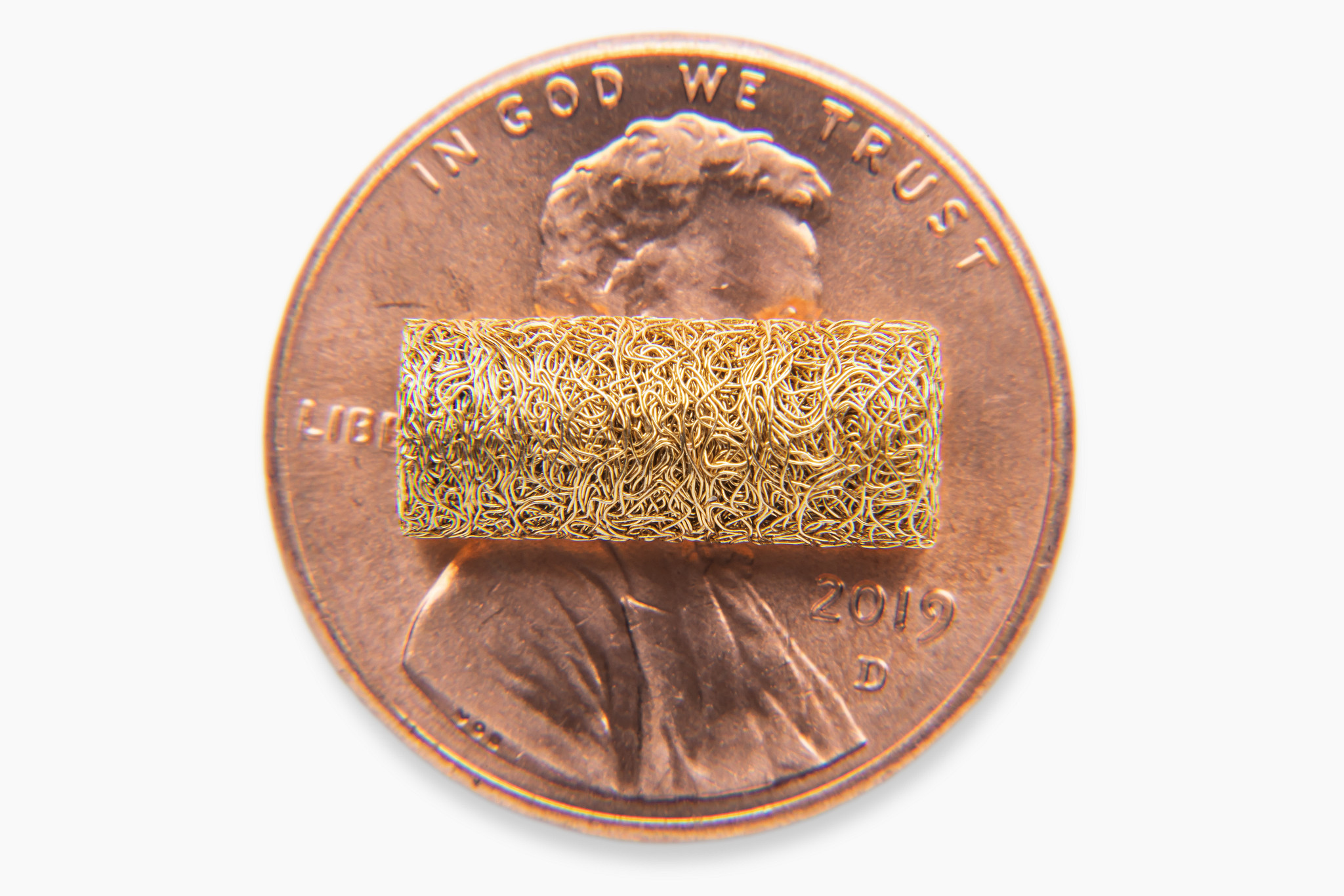 Gold-plated Fuzz Button contact for high shock and vibration military interconnect applications